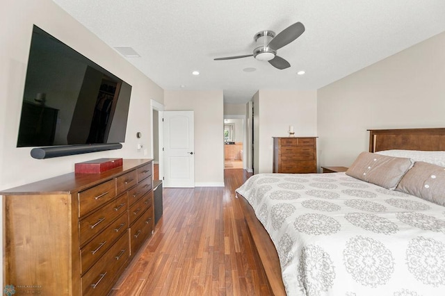 2501 30th Ave S Unit 201, Fargo, ND 58103 - bedroom featuring wood finished floors, recessed lighting, baseboards, and a ceiling fan