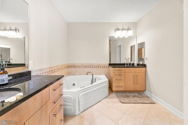 2501 30th Ave S Unit 201, Fargo, ND 58103 - full bath with tile patterned flooring, a jetted tub, and two vanities