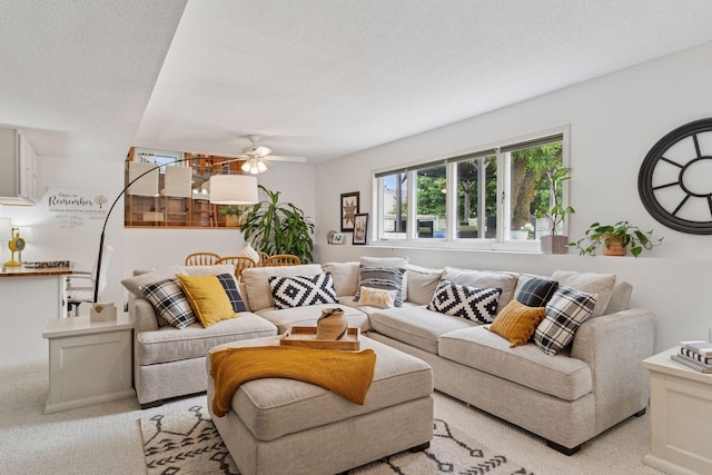 4084 Wild Goose Ln, White Bear Twp, MN 55110 - living area featuring light colored carpet, a ceiling fan, and a textured ceiling