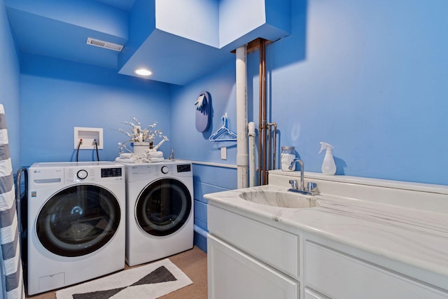 4084 Wild Goose Ln, White Bear Twp, MN 55110 - laundry area with washer and clothes dryer and a sink