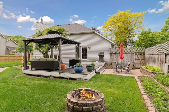 4084 Wild Goose Ln, White Bear Twp, MN 55110 - rear view of house featuring an outdoor living space with a fire pit, a gazebo, a deck, and a chimney