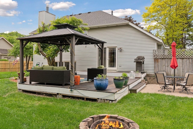 4084 Wild Goose Ln, White Bear Twp, MN 55110 - rear view of property featuring a gazebo, a deck, and an outdoor living space with a fire pit