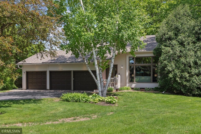 12762 Foliage Ave, Apple Valley, MN 55124 - view of front of house with driveway, an attached garage, a front lawn, and roof with shingles