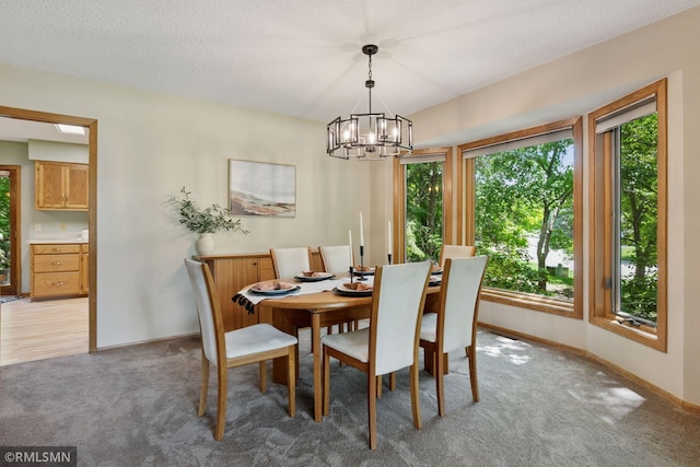 12762 Foliage Ave, Apple Valley, MN 55124 - dining space featuring plenty of natural light, a chandelier, light colored carpet, and baseboards