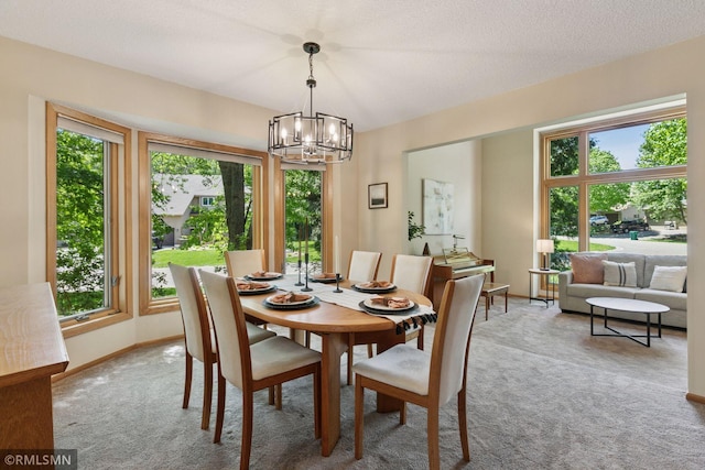 12762 Foliage Ave, Apple Valley, MN 55124 - carpeted dining room featuring a chandelier and baseboards