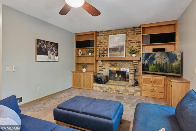 12762 Foliage Ave, Apple Valley, MN 55124 - living room featuring a brick fireplace, carpet, a ceiling fan, and baseboards