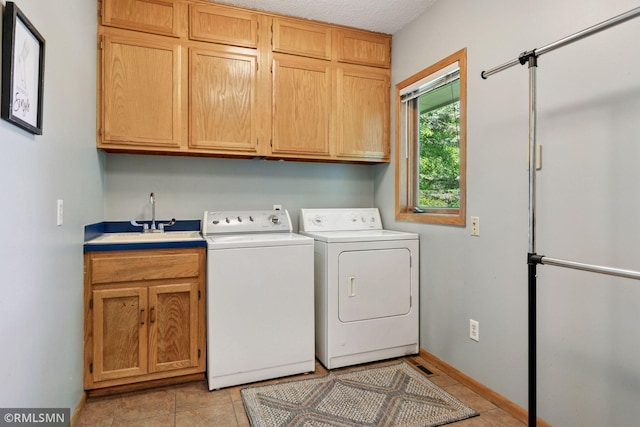 12762 Foliage Ave, Apple Valley, MN 55124 - washroom with cabinet space, separate washer and dryer, light tile patterned flooring, and baseboards