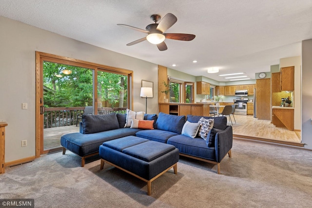 12762 Foliage Ave, Apple Valley, MN 55124 - living room featuring light colored carpet, a ceiling fan, and baseboards