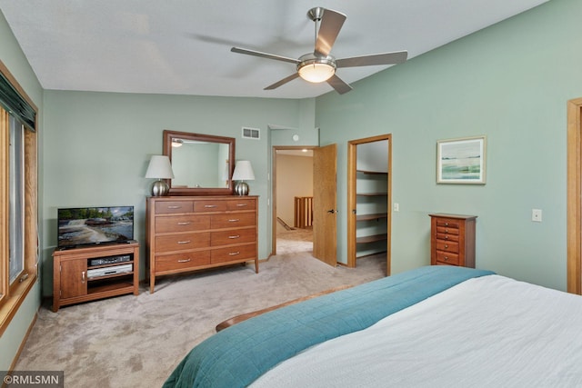 12762 Foliage Ave, Apple Valley, MN 55124 - bedroom featuring lofted ceiling, light colored carpet, a closet, ceiling fan, and a walk in closet