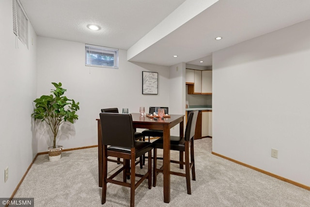 12762 Foliage Ave, Apple Valley, MN 55124 - dining space featuring light colored carpet, baseboards, and recessed lighting
