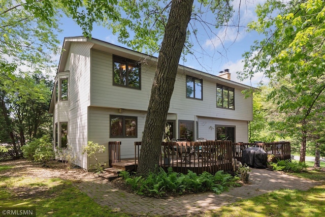 12762 Foliage Ave, Apple Valley, MN 55124 - view of front of property featuring a chimney and a wooden deck