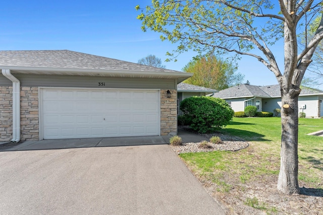 351 100th Ct NE, Blaine, MN 55434 - view of home's exterior with stone siding, a shingled roof, a lawn, asphalt driveway, and a garage