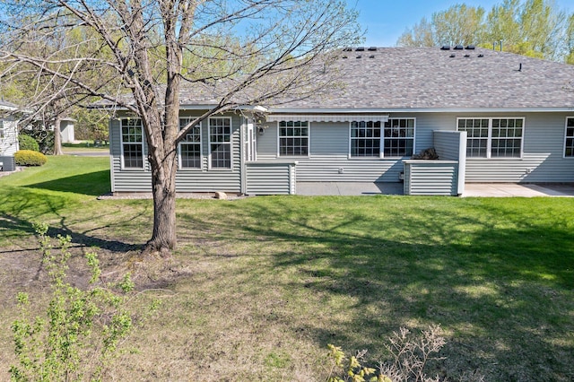 351 100th Ct NE, Blaine, MN 55434 - rear view of property featuring a lawn