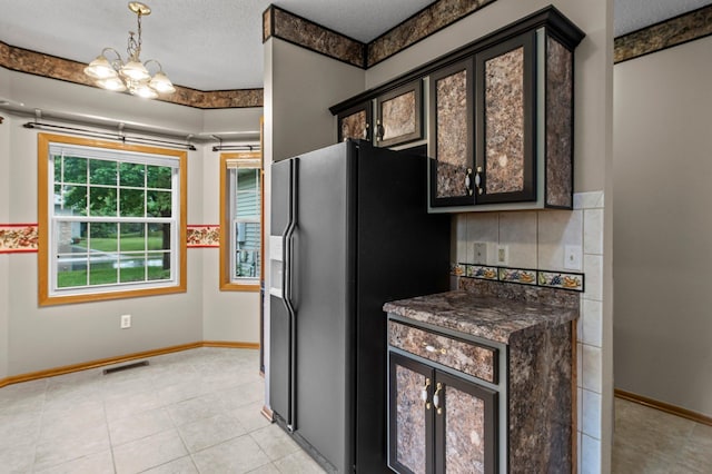 351 100th Ct NE, Blaine, MN 55434 - kitchen with refrigerator with ice dispenser, dark countertops, backsplash, a chandelier, and a textured ceiling