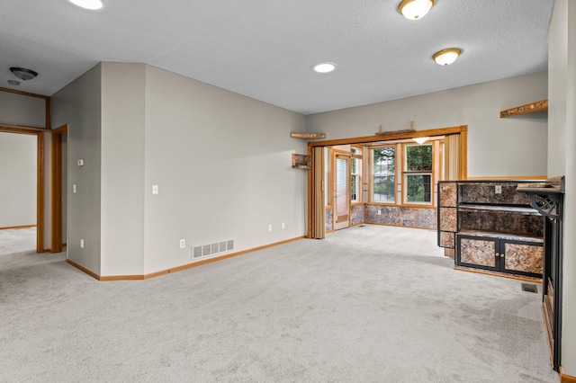 351 100th Ct NE, Blaine, MN 55434 - unfurnished living room featuring carpet floors, a textured ceiling, and recessed lighting