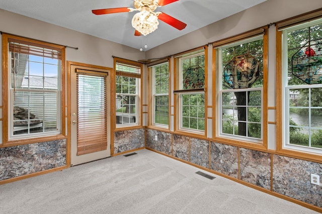 351 100th Ct NE, Blaine, MN 55434 - unfurnished sunroom with carpet flooring and baseboards