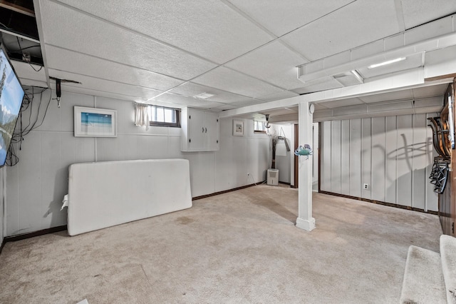 below grade area with light colored carpet
