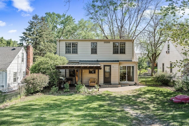 rear view of house with a patio
