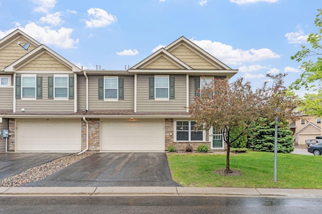 2119 Cedar Grove Trl, Eagan, MN 55122 - view of property with driveway, an attached garage, a front yard, and stone siding