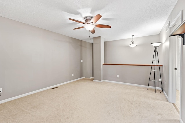 2119 Cedar Grove Trl, Eagan, MN 55122 - carpeted spare room featuring ceiling fan, a textured ceiling, and baseboards