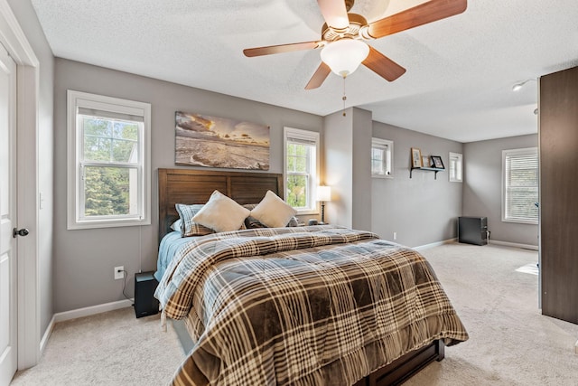2119 Cedar Grove Trl, Eagan, MN 55122 - carpeted bedroom with baseboards, a textured ceiling, and ceiling fan