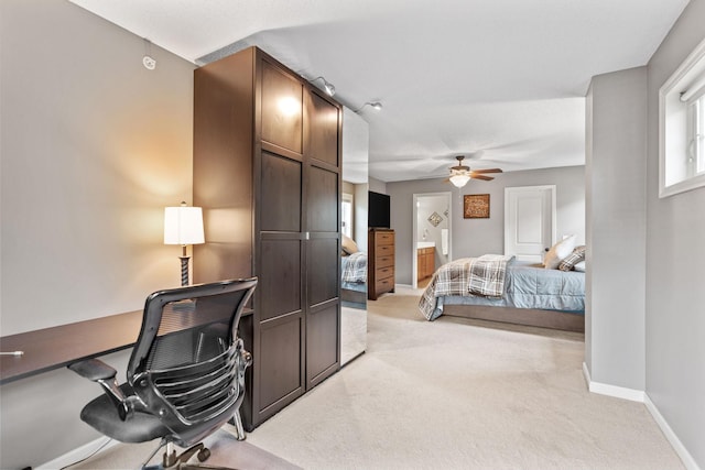 2119 Cedar Grove Trl, Eagan, MN 55122 - bedroom with light carpet, an office area, baseboards, ensuite bath, and ceiling fan