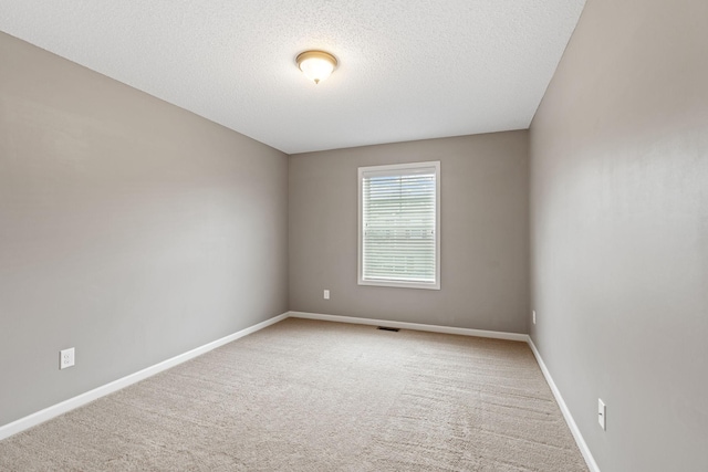 2119 Cedar Grove Trl, Eagan, MN 55122 - carpeted spare room with a textured ceiling and baseboards