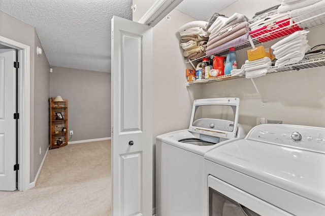 2119 Cedar Grove Trl, Eagan, MN 55122 - laundry room featuring washing machine and dryer, light colored carpet, and a textured ceiling