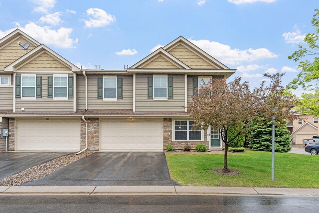 2119 Cedar Grove Trl, Eagan, MN 55122 - multi unit property featuring driveway, a garage, a front lawn, and stone siding