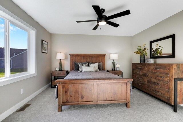 17795 Hoover St NW, Elk River, MN 55330 - bedroom with light carpet, baseboards, and a ceiling fan