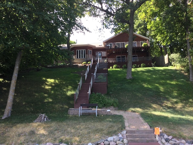 14473 Barnes Dr, Lake View Twp, MN 56501 - view of front of home with stairs, a front lawn, and a wooden deck