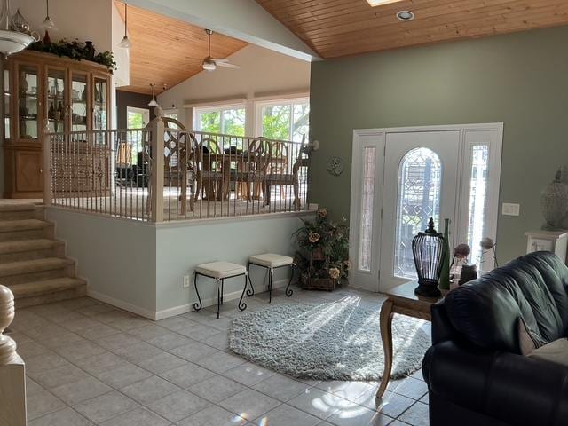 14473 Barnes Dr, Lake View Twp, MN 56501 - tiled foyer featuring wood ceiling, a ceiling fan, baseboards, high vaulted ceiling, and a skylight