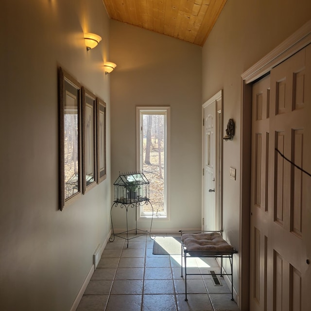 14473 Barnes Dr, Lake View Twp, MN 56501 - hall featuring baseboards, wood ceiling, and high vaulted ceiling