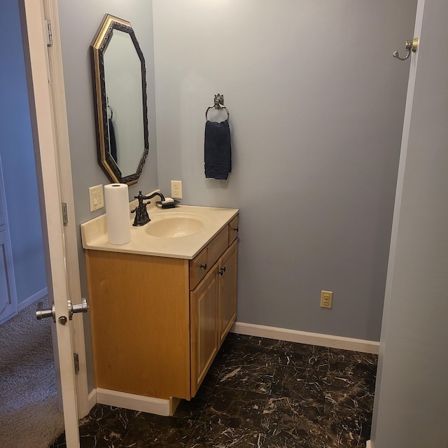 14473 Barnes Dr, Lake View Twp, MN 56501 - bathroom featuring vanity, marble look tiles, and baseboards
