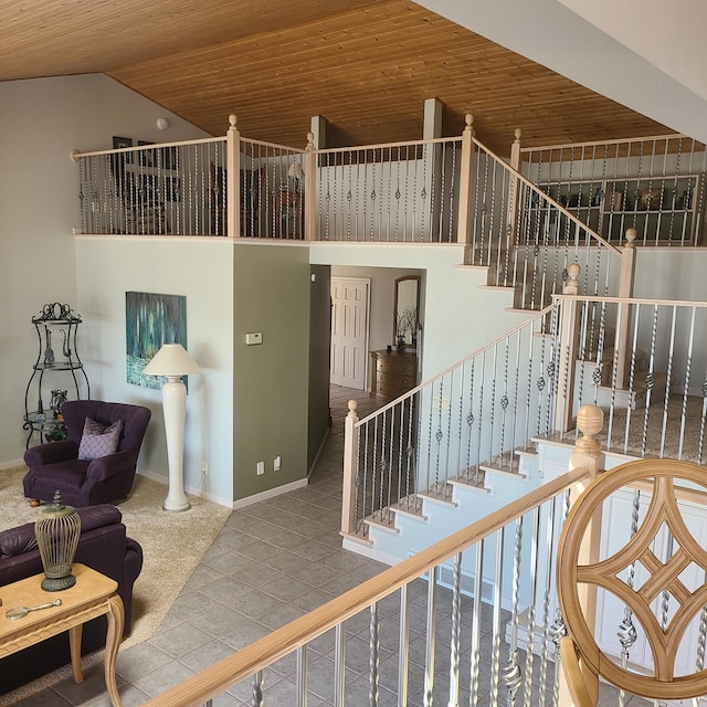 14473 Barnes Dr, Lake View Twp, MN 56501 - stairs with wooden ceiling, lofted ceiling, carpet floors, and baseboards
