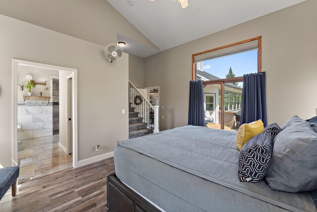 W10415 521st Ave, Prescott, WI 54021 - bedroom with lofted ceiling, dark wood-style floors, access to outside, baseboards, and ensuite bathroom