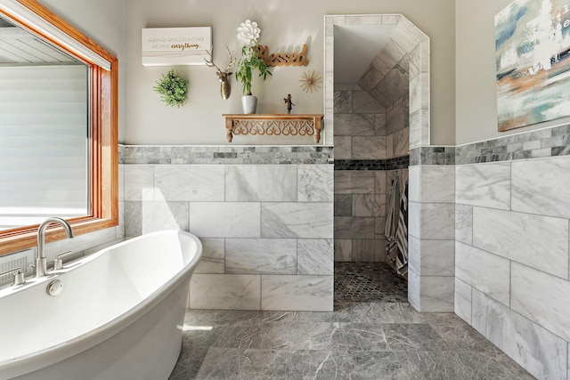 W10415 521st Ave, Prescott, WI 54021 - bathroom with tile walls, a soaking tub, wainscoting, and a walk in shower