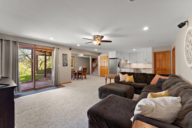 W10415 521st Ave, Prescott, WI 54021 - living room featuring light colored carpet, stairs, recessed lighting, and a ceiling fan