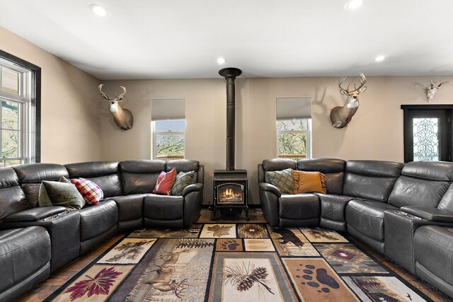 W10415 521st Ave, Prescott, WI 54021 - living area featuring a wood stove, recessed lighting, and wood finished floors