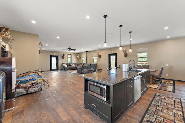W10415 521st Ave, Prescott, WI 54021 - kitchen featuring a sink, stainless steel appliances, recessed lighting, dark wood finished floors, and a kitchen island with sink
