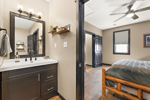 W10415 521st Ave, Prescott, WI 54021 - bedroom with light wood-type flooring, baseboards, and a sink
