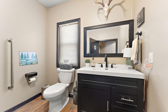 W10415 521st Ave, Prescott, WI 54021 - bathroom with toilet, vanity, and baseboards