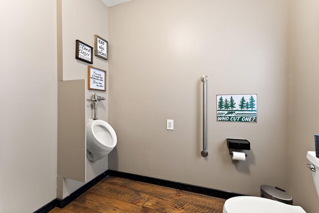 W10415 521st Ave, Prescott, WI 54021 - bathroom with toilet, wood finished floors, and baseboards