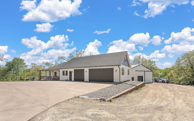 W10415 521st Ave, Prescott, WI 54021 - view of front of property with concrete driveway, covered porch, and a garage