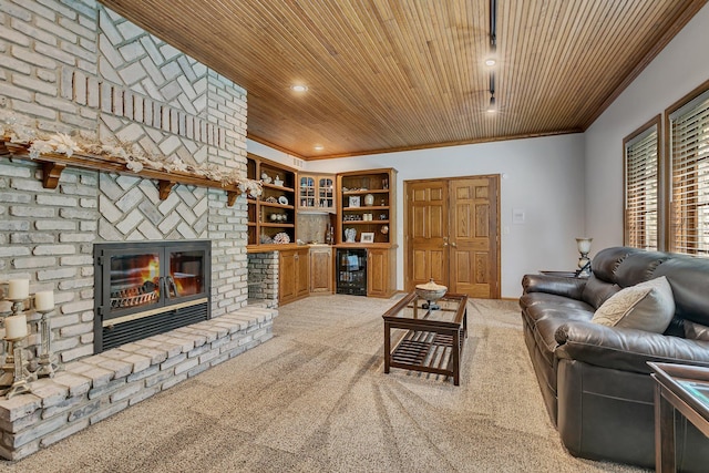 carpeted living area with wooden ceiling, a fireplace, beverage cooler, crown molding, and recessed lighting