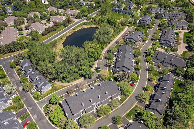 view of property location with a nearby body of water and nearby suburban area