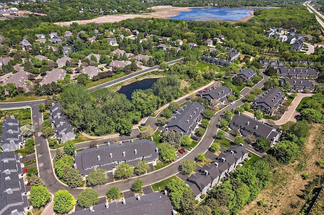 aerial overview of property's location with a large body of water and nearby suburban area
