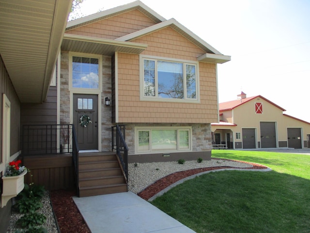 8300 263rd St, Saint Cloud, MN 56301 - property entrance featuring a lawn and stone siding