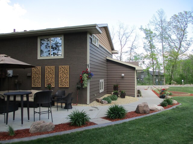 8300 263rd St, Saint Cloud, MN 56301 - rear view of property with a patio area and a yard
