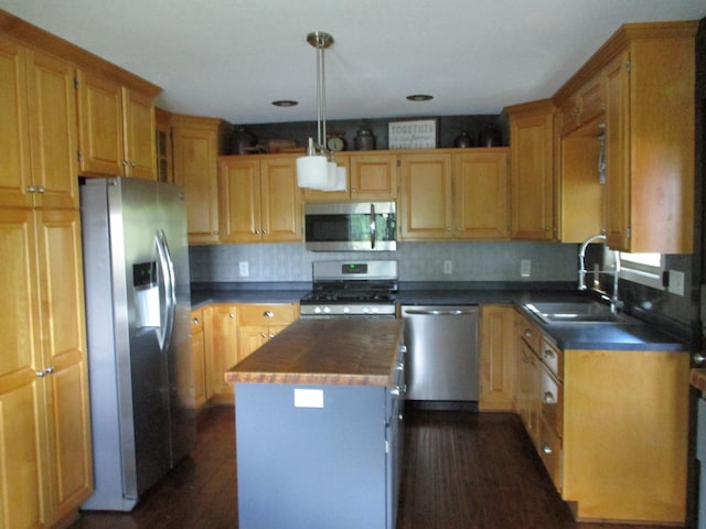 8300 263rd St, Saint Cloud, MN 56301 - kitchen featuring stainless steel appliances, a center island, a sink, butcher block counters, and dark wood-type flooring